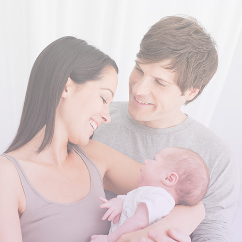 parents mother and father holding new born baby fertility treatment